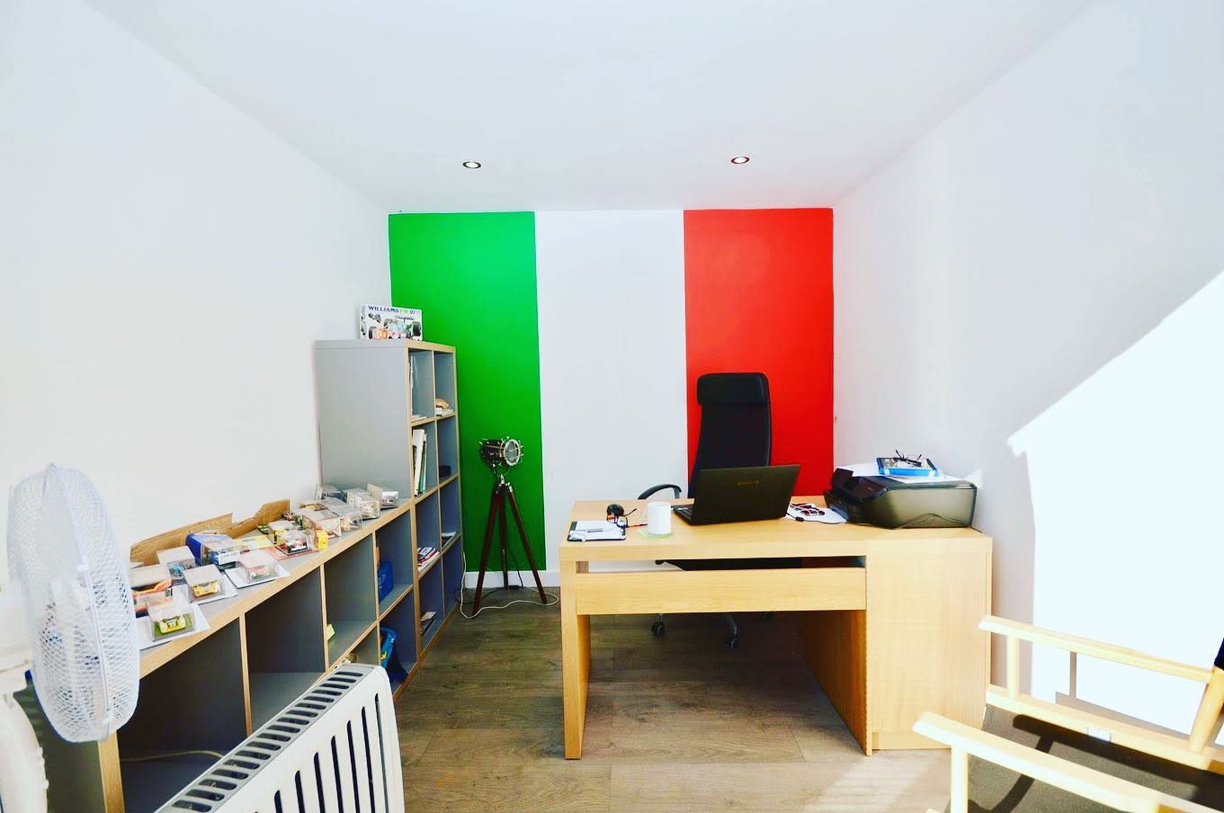 garage office wood desk italian flag feature wall 